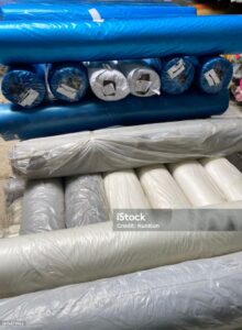 Stack of colourful cloth rolls