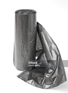 Roll of cellophane sacks for garbage on a white background